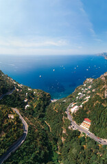 Aerial view of Laurito, Positano - curve mountain road. Sunny summer day with blue sky, clear sea of Sorrento coast. Travel and vacation. vertical photo, Europe