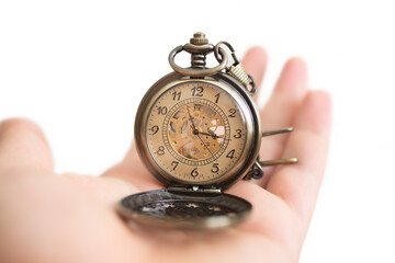 Men hands hold a pocket watch and a white background.