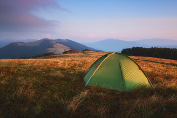 Green tent in spring mountains. Amazing evening highland. Landscape photography © Ivan Kmit