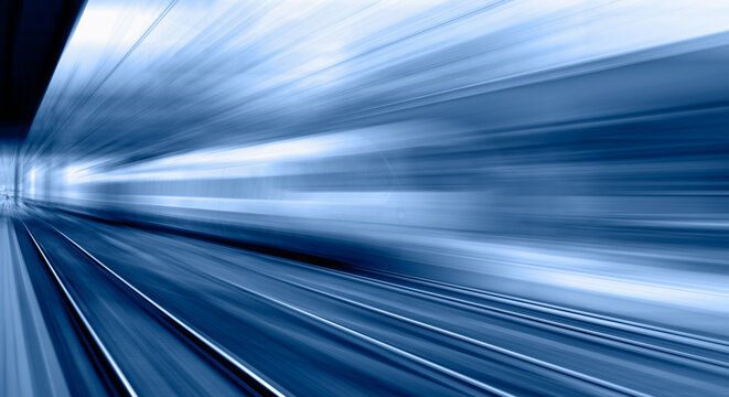High speed train runs on rail tracks . Train in motion