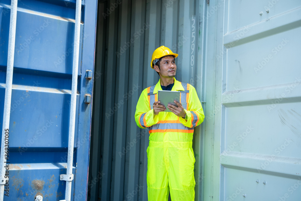 Aufkleber asian foreman working and checking container box for logistic export and import at logistic shipping