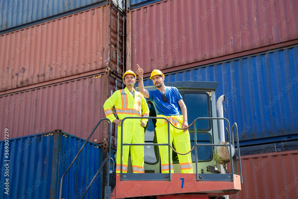Aufkleber foreman and staff checking at container cargo harbor holding tablet to loading containers for logist