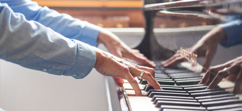Pianist while playing on a grand piano sensitive sensitive accuracy precision piano playing bliss emotion life work artist pianist practiced stress relieving music history sensitive discipline 