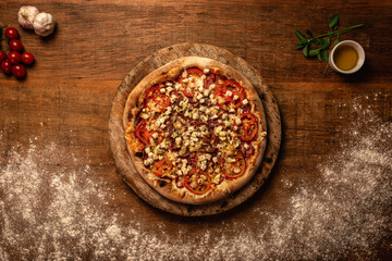 Top down pizza on wooden table for restaurant menu
