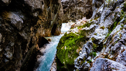 Clear water streams through gorge