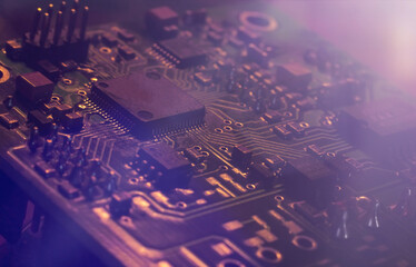 Kind over lilac neon abstract tech computer background. Printed circuit board (PCB) and electronic...