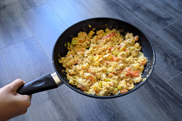 Fried eggs in a pan fresh delicious morning healthy dish to hold in your hand