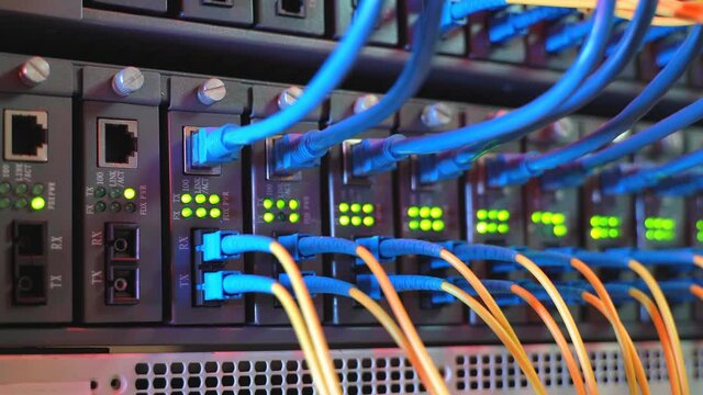 Fiber Optic cables connected to optic ports and UTP, Network cables connected to ethernet ports