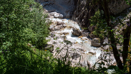 Clear water streams through gorge