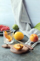 Peaches cut into slices, limes and lemons, berries on the table, for stepwise preparation of detox water, home cooking, healthy food
