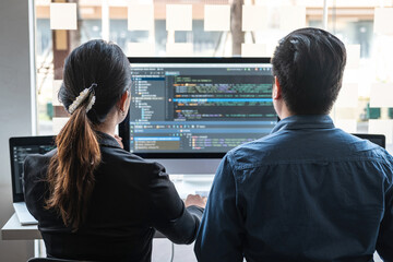 Team of programmer brainstorming and programming in website working a software