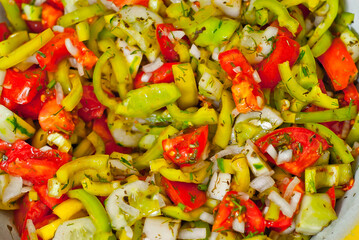 Lettuce texture close up. Fresh salad of vegetables, tomatoes and cucumbers.