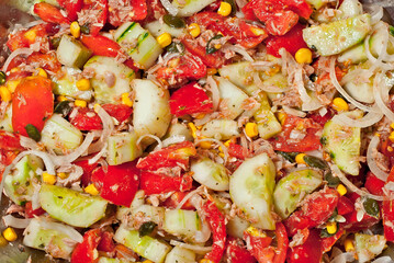 Lettuce texture close up. Fresh salad of vegetables, tomatoes and cucumbers.