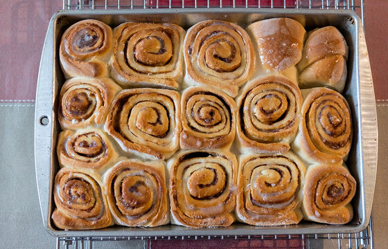 Homemade Lovely And Golden Cinnamon Buns In Pan.