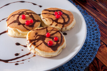 pancakes with red berry and chocolate topping