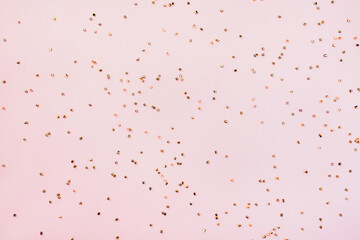 Glitters on a pink background, christmas and new year fun concept