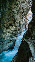 Clear water streams through gorge