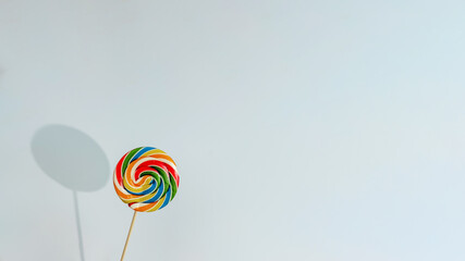 Colorful lollipop with a hard shadow