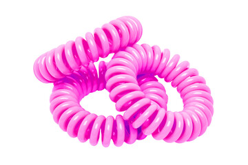 Hair care tools isolated. Close-up of a cream colored elastic spiral scrunchy or hair band for women hairstyling isolated on a white background. Tools from hairdresser and beauty salon. Macro.