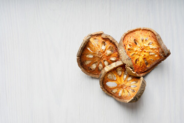 Top view of three slices of of dried bael fruit, also known as wood apple, which is used for...