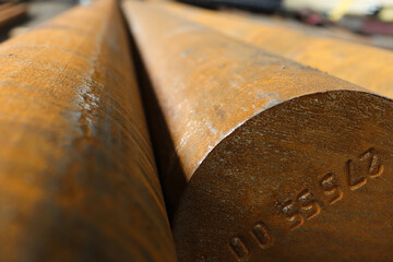 Large diameter steel bar manufactured at a metal rolling plant.