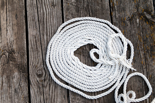white rope on wooden deck view from above
