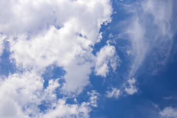 Blue sky and white puffy clouds