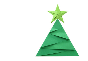 A green origami chirstmas tree with star on white