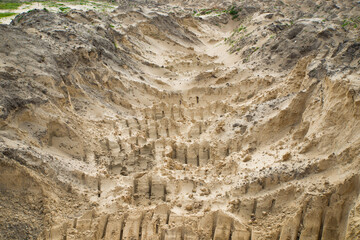 Sand quarry. Texture. Traces of production.