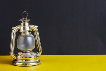 Coal miners lamp on black and yellow background