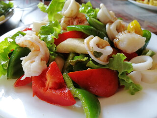 close-up mix of seafood salad shrimp and fresh vegetables. Delicious and healthy food