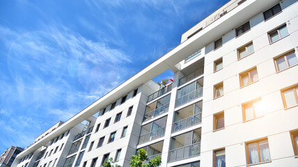 Modern apartment building. Balconies at apartment residential building. Residential architecture. Glass surface with Glass surface with sunlight..