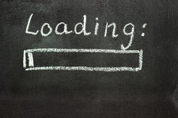 The loading process is shown in white on a chalkboard. Stop motion animation.
