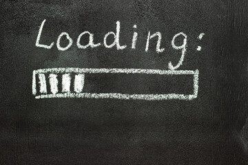 The loading process is shown in white on a chalkboard. Stop motion animation.