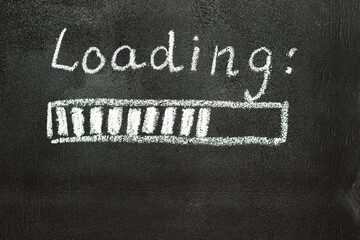 The loading process is shown in white on a chalkboard. Stop motion animation.
