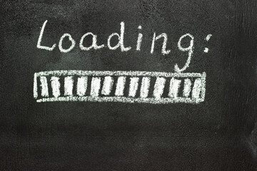The loading process is shown in white on a chalkboard. Stop motion animation.