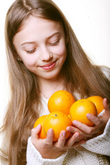 child with an oranges