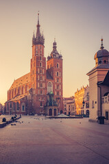 Krakow, Poland, St Mary's church on the Main Square in the morning sunlight - obrazy, fototapety, plakaty