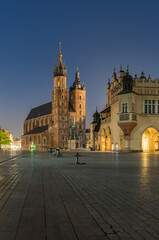 Naklejka na ściany i meble Main market square, Cloth Hall and St Mary's church in the night, Krakow, Poland