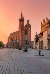 Main square with St Mary's church, colorful sunrise, Krakow, Poland