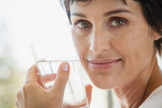 Close up portrait woman drinking water