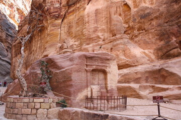 Passage through Sik canyon to the temple-mausoleum of Al-Khazneh in the ancient city of Petra in Jordan