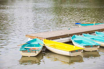 Fototapeta premium Boat rental on the lake. Boats at the pier. Rental services