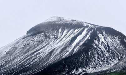 Antarctica, deception island, white snow on volcanic black mountain, snow storm © HWL Photos