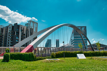 Modern cycle and pedestrian footbridge that connects Gino Valle square with the Portello park in Milan
