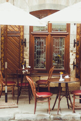 Cozy tables with chairs in the old city cafe