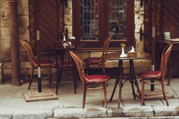 Cozy tables with chairs in the old city cafe