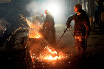 worker cuts steel