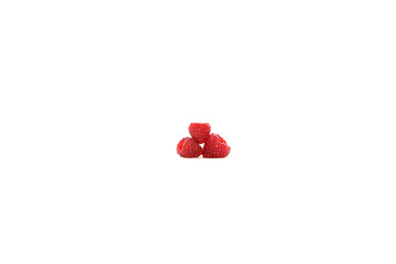 Isolated color image of ripe sweet raspberry. Three red berries. Healthy eating. Vitamins in fruits. Raw food, vegetarianism and veganism. Object shooting.