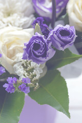 Beautiful bouquet of white and purple flowers. Decorative flower arrangement for the holiday. Closeup.